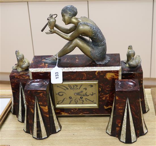A 1930s faux tortoiseshell and faux mother-of-pearl spelter mounted figural clock garniture clock height 41cm